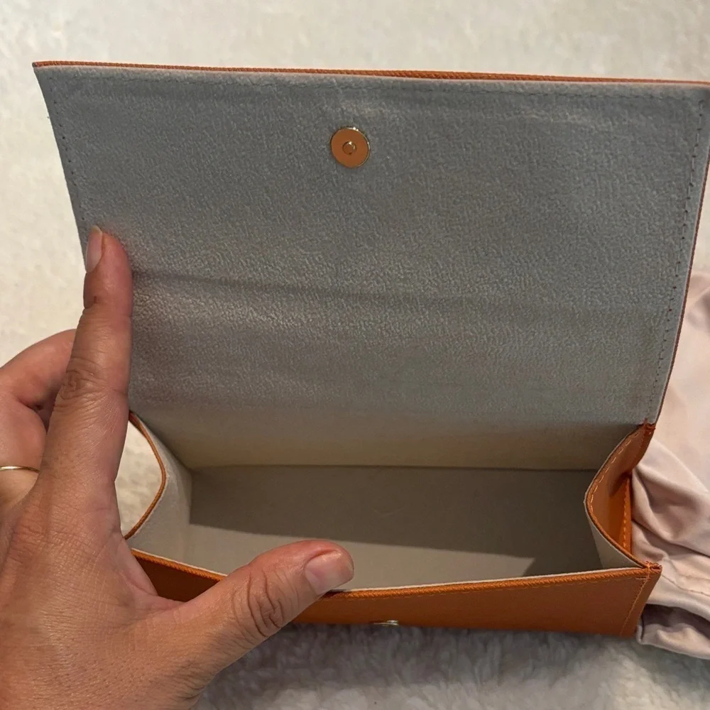 Tory Burch Burnt Orange case of sunglasses
